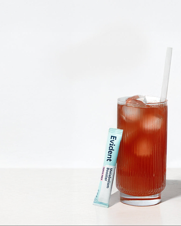 Three glasses of iced drinks with straws and Evident brand packets on a white background
